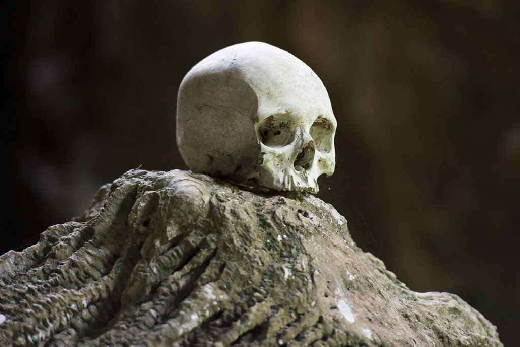 Burial cave called Londa in Tana Toraja, Indonesia, with tau-tau statues and skulls