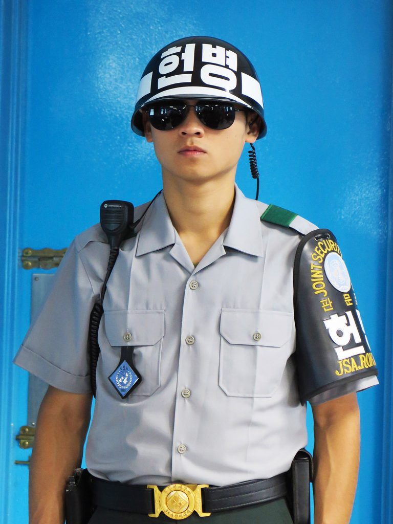 A guard at the Joint Security Area (JSA) in the Korean Demilitarized Zone (DMZ) between North and South Korea.