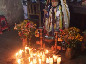 A shrine to Mayan deity and folk saint, Maximón, in Santiago Atitlán, Guatemala.