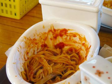 A miniature toilet is used as a bowl for serving spaghetti bolognaise at the Poop Cafe (Ddong Cafe) in Seoul, South Korea.