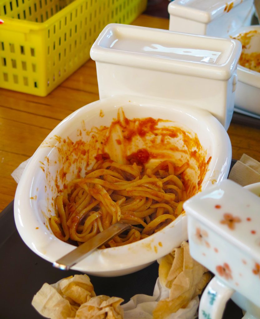 A miniature toilet is used as a bowl for serving spaghetti bolognaise at the Poop Cafe (Ddong Cafe) in Seoul, South Korea.