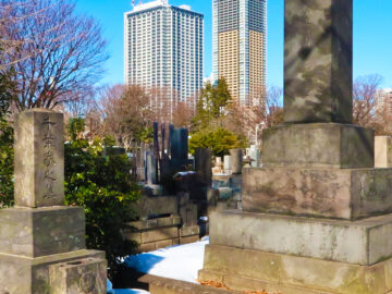 Headstones honouring the dead sit amongst modern tower blocks in Tokyo’s serene Zōshigaya Cemetery, Minami-Ikebukuro.