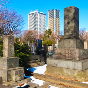 Headstones honouring the dead sit amongst modern tower blocks in Tokyo’s serene Zōshigaya Cemetery, Minami-Ikebukuro.