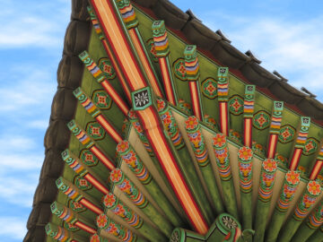 A beautifully painted and sculpted roof in Deoksugung, a walled compound of palaces in Seoul, South Korea.