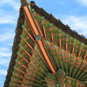 A beautifully painted and sculpted roof in Deoksugung, a walled compound of palaces in Seoul, South Korea.