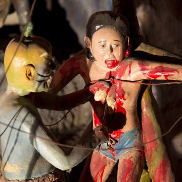 A gory statue of sinners being tortured in Haw Par Villa, Singapore